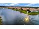Aerial view of lakefront community with fountains and homes at 6139 Grand Cypress Blvd, North Port, FL 34287