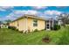 Nicely landscaped backyard with screened enclosure at 6139 Grand Cypress Blvd, North Port, FL 34287