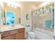 Bathroom with tub shower, vanity, and toilet at 6139 Grand Cypress Blvd, North Port, FL 34287