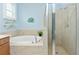Bathroom with a shower and garden tub, double vanity at 6139 Grand Cypress Blvd, North Port, FL 34287