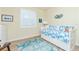 Bedroom with daybed, dresser, and rug at 6139 Grand Cypress Blvd, North Port, FL 34287