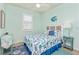 Guest bedroom with coastal decor and a comfy bed at 6139 Grand Cypress Blvd, North Port, FL 34287