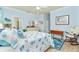 Coastal-styled bedroom featuring a comfortable bed and ocean decor at 6139 Grand Cypress Blvd, North Port, FL 34287