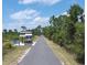 Paved bike path with a rest area and informational kiosk at 6139 Grand Cypress Blvd, North Port, FL 34287
