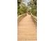 Scenic boardwalk path winds through lush natural landscape at 6139 Grand Cypress Blvd, North Port, FL 34287