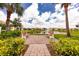 Relaxing community area with benches overlooking a pond at 6139 Grand Cypress Blvd, North Port, FL 34287