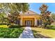 Community clubhouse with inviting entrance and landscaping at 6139 Grand Cypress Blvd, North Port, FL 34287
