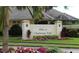 Community entrance sign for Villas at Charleston Park, featuring landscaping and brick pillars at 6139 Grand Cypress Blvd, North Port, FL 34287