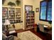 Well-lit community library with ample bookshelves and a work area at 6139 Grand Cypress Blvd, North Port, FL 34287