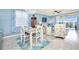 Dining area with a light gray table and coastal decor at 6139 Grand Cypress Blvd, North Port, FL 34287