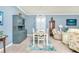 Dining area with a light gray table and coastal decor at 6139 Grand Cypress Blvd, North Port, FL 34287