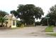 Community entrance with gated access and landscaping at 6139 Grand Cypress Blvd, North Port, FL 34287