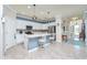 White kitchen with island, stainless steel appliances, and blue accents at 6139 Grand Cypress Blvd, North Port, FL 34287