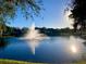 Scenic lake view with fountain in community at 6139 Grand Cypress Blvd, North Port, FL 34287