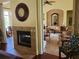 Living room with fireplace and view into game area at 6139 Grand Cypress Blvd, North Port, FL 34287