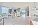 Open concept living area with light tile floors and coastal decor at 6139 Grand Cypress Blvd, North Port, FL 34287