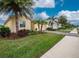 Landscaped neighborhood with similar homes and a sidewalk at 6139 Grand Cypress Blvd, North Port, FL 34287