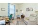 Home office with a desk, chair, and recliner at 6139 Grand Cypress Blvd, North Port, FL 34287