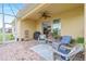 Outdoor screened patio featuring comfortable seating and a built-in grill at 6139 Grand Cypress Blvd, North Port, FL 34287