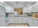 White kitchen with granite countertops and stainless steel appliances at 8055 Dorothy Ave, North Port, FL 34287