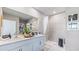 Clean bathroom with double vanity and a large shower at 9578 Turtle Grass Cir, Punta Gorda, FL 33950