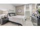 Cozy bedroom with black and white bedding and modern decor at 9578 Turtle Grass Cir, Punta Gorda, FL 33950