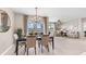 Open concept dining room with modern light fixture and view at 9578 Turtle Grass Cir, Punta Gorda, FL 33950