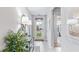 Bright and airy entryway with tiled floors and modern decor at 9578 Turtle Grass Cir, Punta Gorda, FL 33950