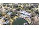 Aerial view of community pool, lake, and tennis courts at 10810 Cedar Breaks Dr, Port Richey, FL 34668