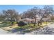 Aerial view of a residential neighborhood with single-Gathering homes and lush landscaping at 10810 Cedar Breaks Dr, Port Richey, FL 34668