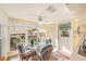 Kitchen breakfast nook with glass table and wicker chairs at 10810 Cedar Breaks Dr, Port Richey, FL 34668