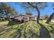 Single-story house exterior with a well-maintained lawn and landscaping at 10810 Cedar Breaks Dr, Port Richey, FL 34668