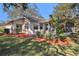 House exterior showcasing landscaping and screened patio at 10810 Cedar Breaks Dr, Port Richey, FL 34668