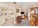 Kitchen features white appliances and view into living room at 10810 Cedar Breaks Dr, Port Richey, FL 34668