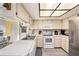 Kitchen features stainless steel refrigerator and white cabinets at 10810 Cedar Breaks Dr, Port Richey, FL 34668