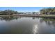 Sparkling lake view with surrounding landscape at 10810 Cedar Breaks Dr, Port Richey, FL 34668