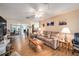 Relaxing living room with hardwood floors, comfortable seating, and a large window at 10810 Cedar Breaks Dr, Port Richey, FL 34668