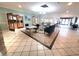 Community clubhouse lobby with comfortable seating and hardwood floors at 10810 Cedar Breaks Dr, Port Richey, FL 34668