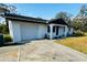 Single story house with yard and driveway at 1100 Belkton Ave, Port Charlotte, FL 33948