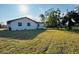 Large backyard with grassy area at 1100 Belkton Ave, Port Charlotte, FL 33948