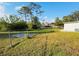 Large backyard with grassy area at 1100 Belkton Ave, Port Charlotte, FL 33948