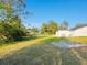 Large backyard with grassy area at 1100 Belkton Ave, Port Charlotte, FL 33948