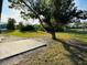 Large backyard with grassy area and patio at 1100 Belkton Ave, Port Charlotte, FL 33948