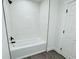 Clean bathroom with white tile and bathtub at 1100 Belkton Ave, Port Charlotte, FL 33948