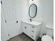 Modern bathroom with white vanity and vinyl plank flooring at 1100 Belkton Ave, Port Charlotte, FL 33948