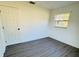 Bright bedroom with vinyl plank flooring and a window at 1100 Belkton Ave, Port Charlotte, FL 33948