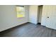 Simple bedroom with vinyl plank flooring and a closet at 1100 Belkton Ave, Port Charlotte, FL 33948