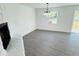 Living room with fireplace and vinyl flooring at 1100 Belkton Ave, Port Charlotte, FL 33948