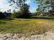 Spacious lot ready for your dream home, featuring a large grassy area at 1100 Belkton Ave, Port Charlotte, FL 33948