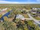 Aerial view of property near canal and neighborhood at 11346 Laffite Pl, Port Charlotte, FL 33981